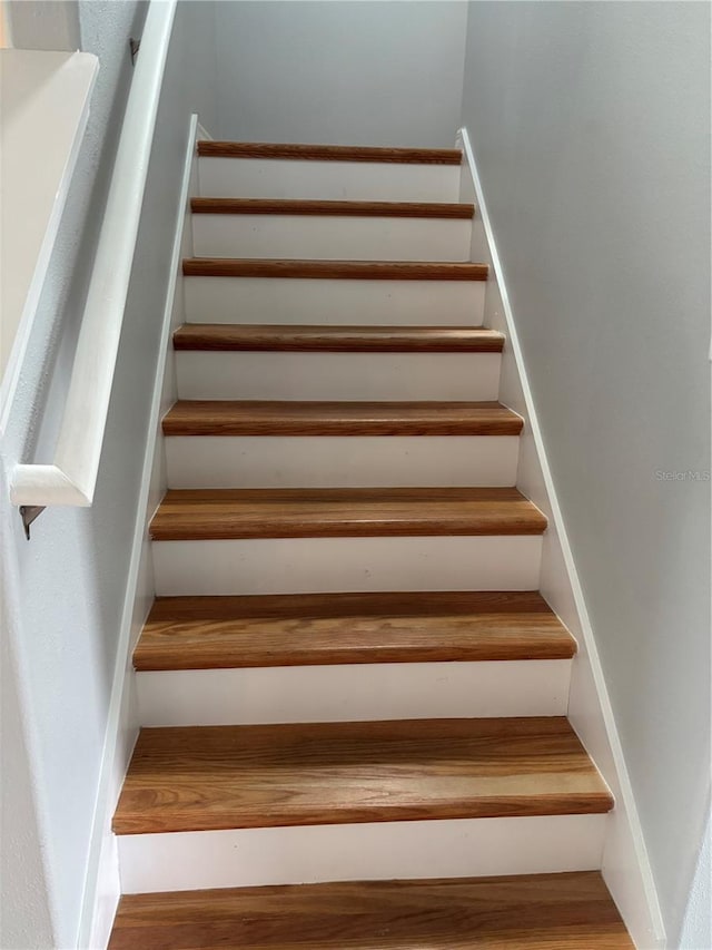 stairs with wood finished floors