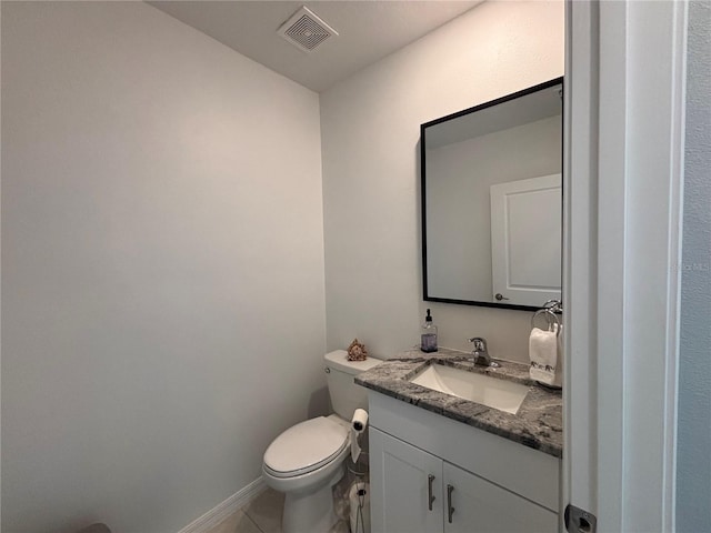 bathroom with visible vents, toilet, tile patterned flooring, baseboards, and vanity