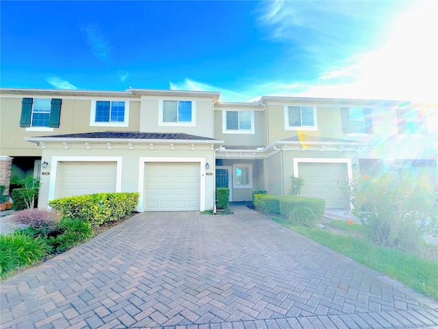 townhome / multi-family property featuring a garage