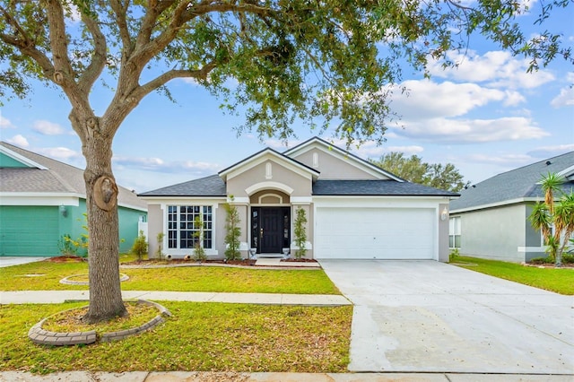 single story home with a garage and a front yard