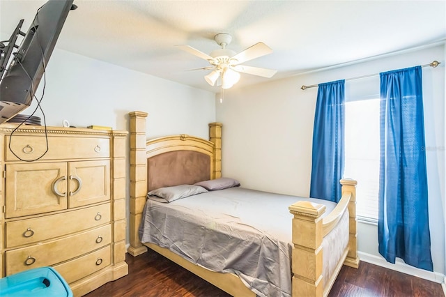 bedroom featuring dark hardwood / wood-style floors and ceiling fan