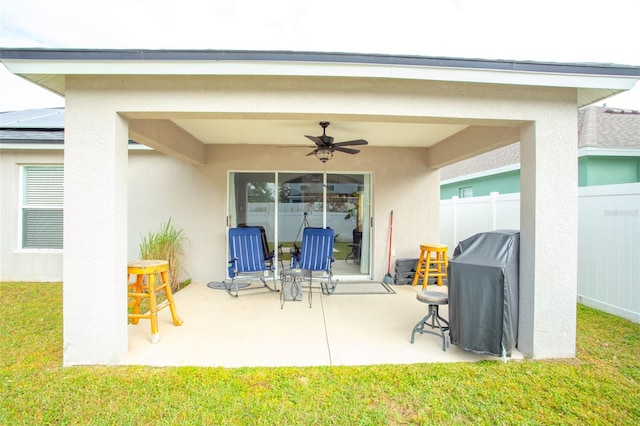 view of patio with ceiling fan and area for grilling