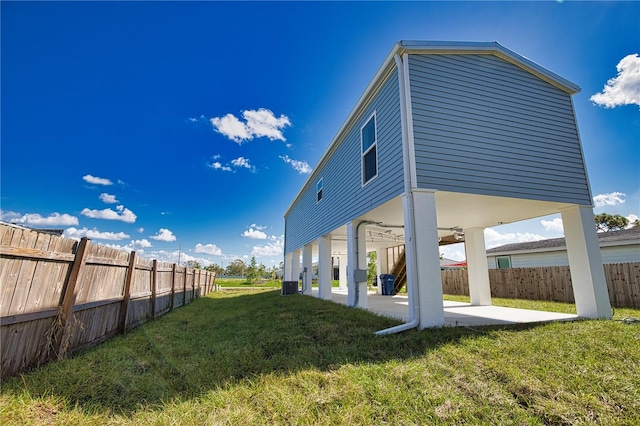 view of yard featuring central AC unit and a patio area