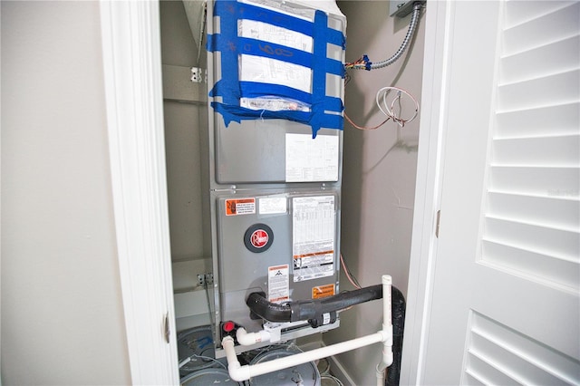 utility room with heating unit