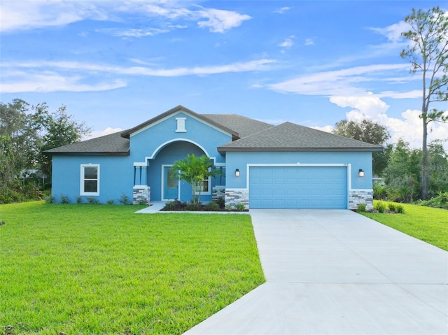 view of front of home featuring a garage and a front yard