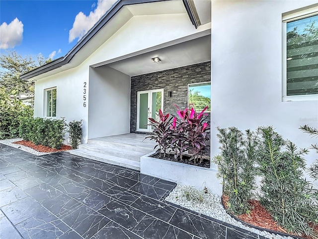 doorway to property with a porch