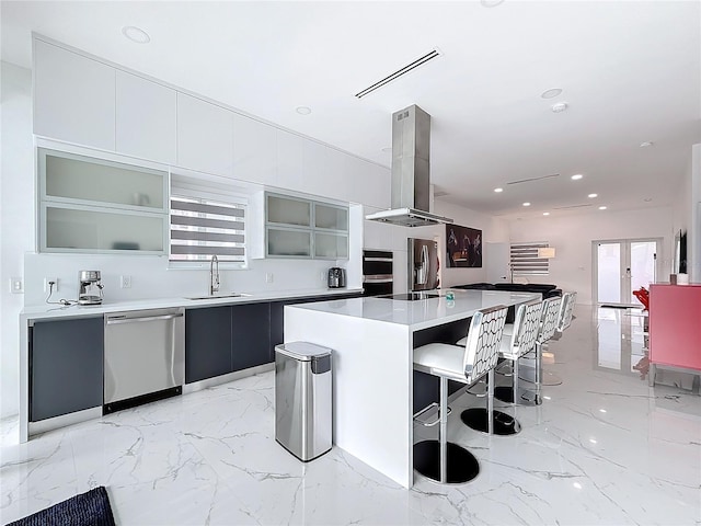 kitchen featuring a healthy amount of sunlight, sink, stainless steel dishwasher, a kitchen island, and island exhaust hood