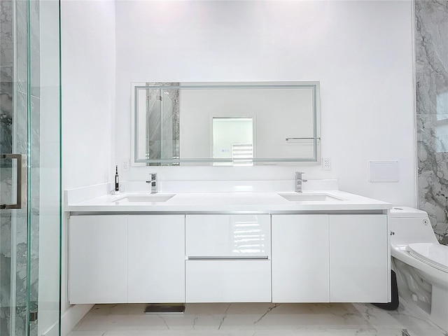 bathroom featuring vanity, toilet, and a shower with door