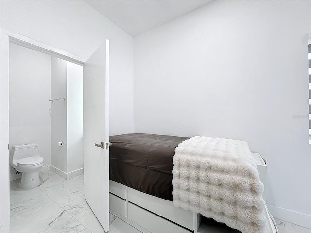 bedroom featuring connected bathroom