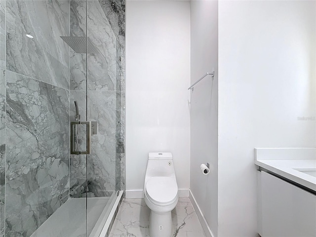 bathroom featuring vanity, a shower with shower door, and toilet