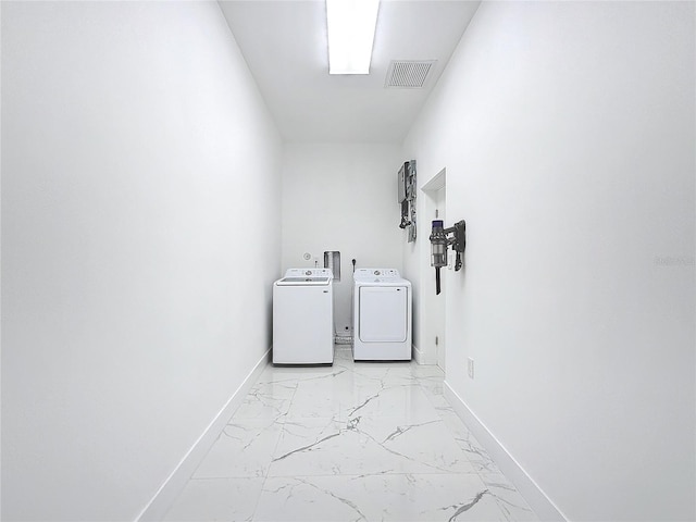 laundry room with separate washer and dryer