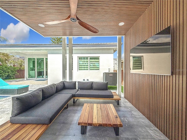 view of patio featuring an outdoor hangout area and ceiling fan