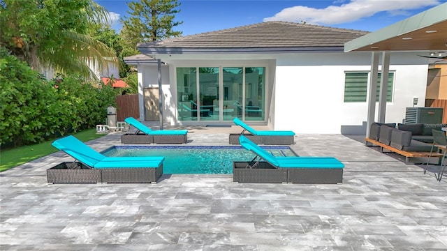 rear view of house featuring a patio