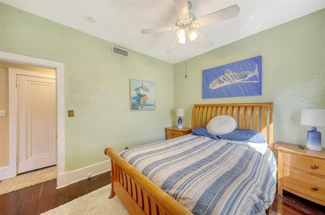 bedroom featuring ceiling fan and dark hardwood / wood-style flooring