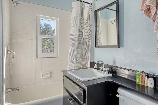 full bathroom with vanity, toilet, and shower / bath combo with shower curtain