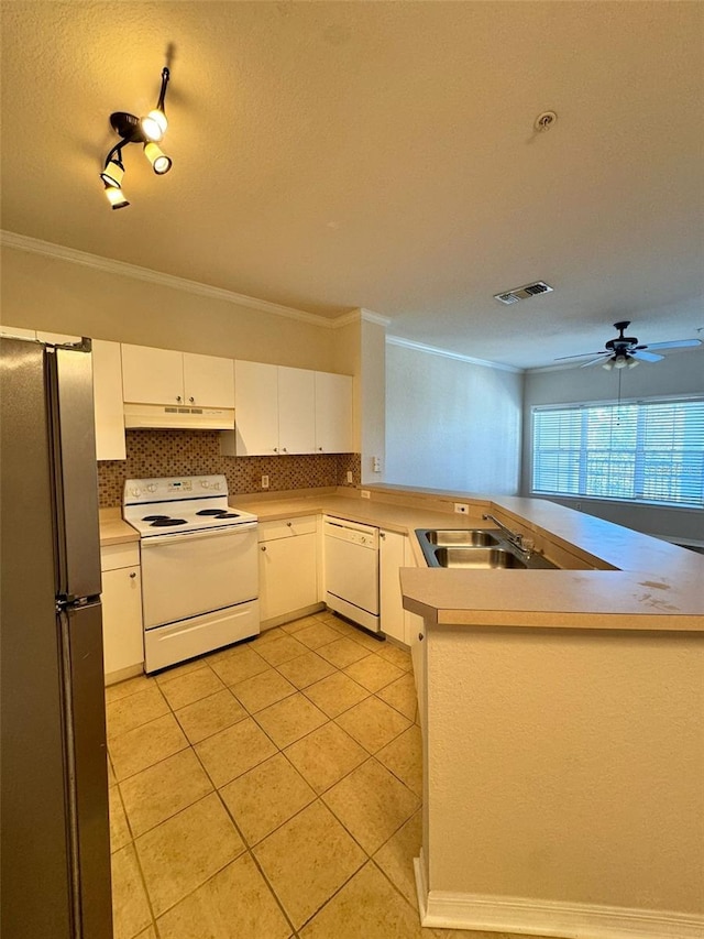 kitchen featuring kitchen peninsula, crown molding, white appliances, decorative backsplash, and white cabinets