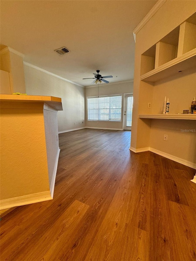 unfurnished living room with hardwood / wood-style flooring, ceiling fan, and ornamental molding