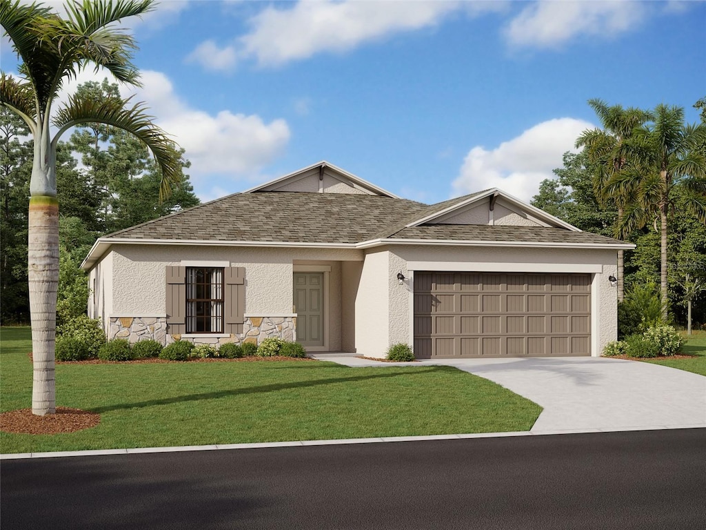 view of front of property with a front lawn and a garage