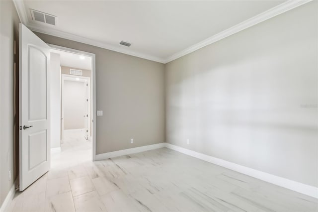 empty room featuring crown molding