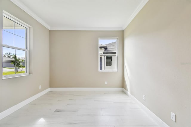 spare room with crown molding