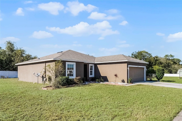 ranch-style house with a garage and a front lawn