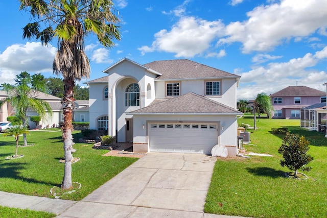 view of front property with a front lawn and a garage