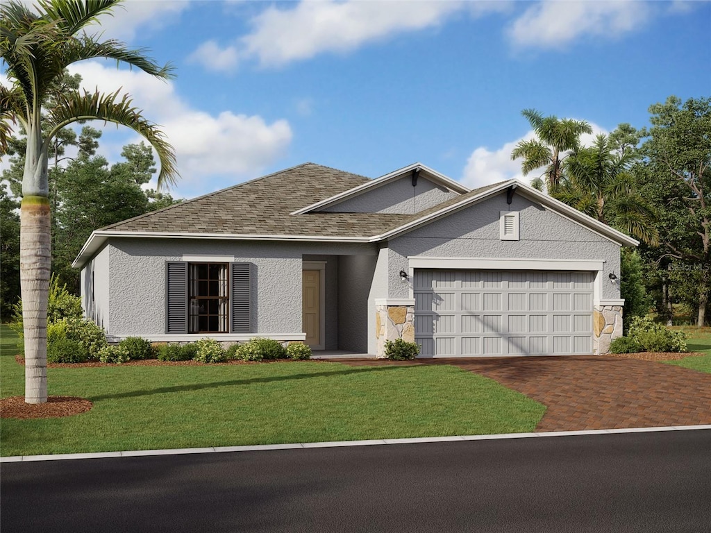 view of front facade featuring a front lawn and a garage