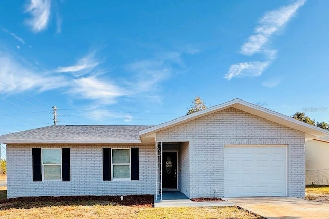 ranch-style home featuring a garage