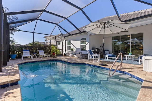 view of pool with a lanai and a patio