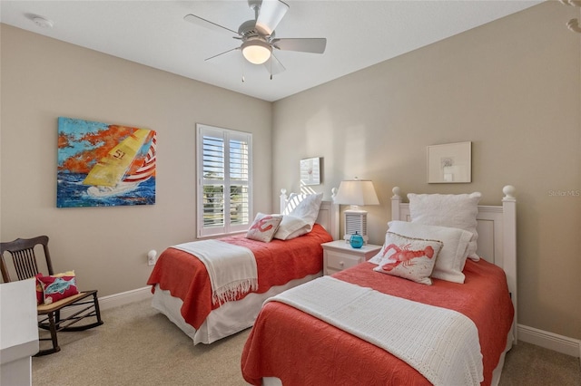 bedroom featuring ceiling fan and light carpet