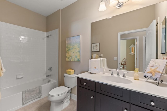 full bathroom with tile patterned flooring, tiled shower / bath combo, toilet, and vanity