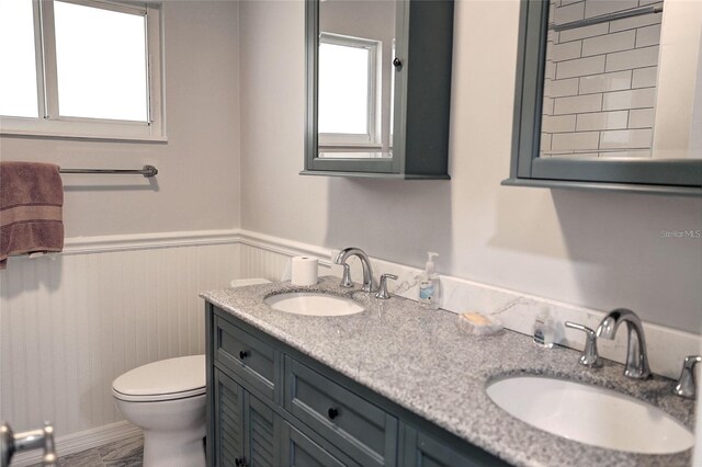 bathroom featuring vanity and toilet