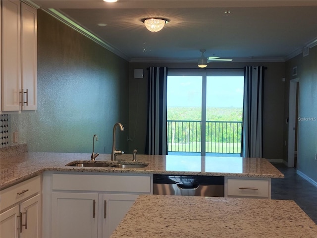 kitchen with white cabinets, dishwasher, ornamental molding, and sink