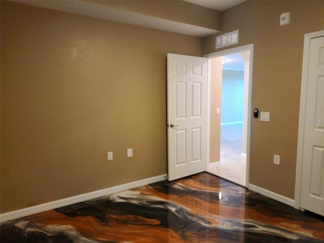 empty room with dark hardwood / wood-style floors