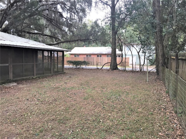 view of yard featuring a sunroom