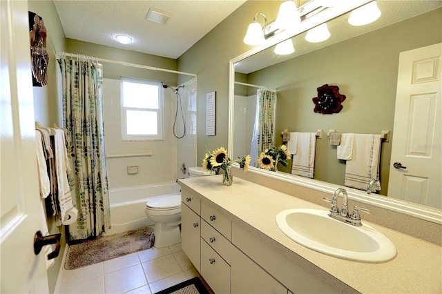 full bath with a textured ceiling, tile patterned flooring, toilet, shower / tub combo, and vanity