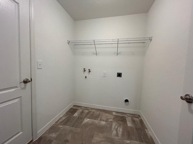 clothes washing area with washer hookup and electric dryer hookup