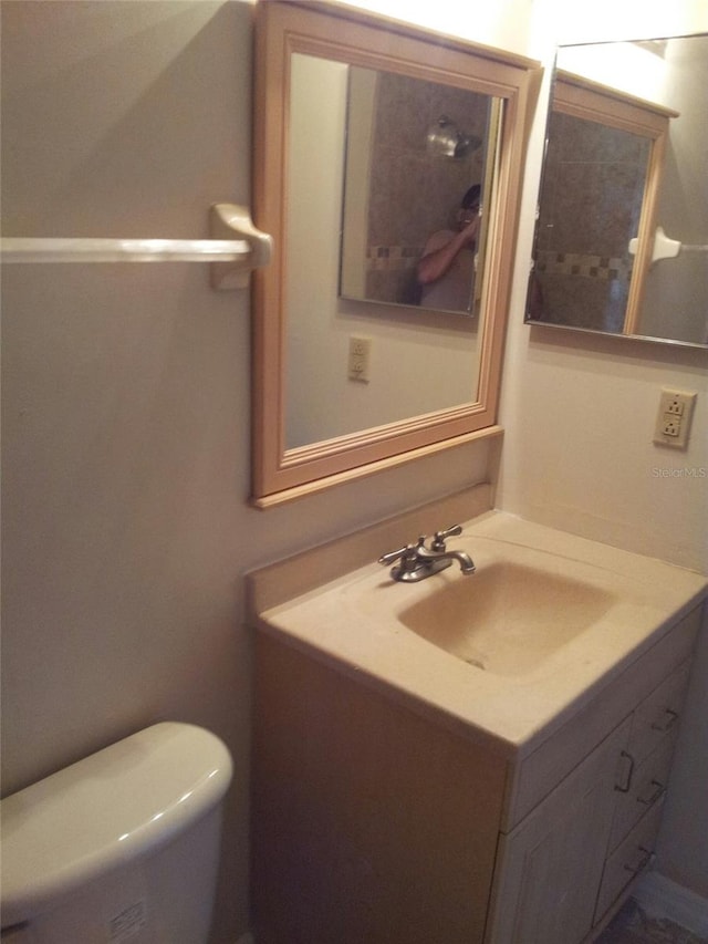 bathroom with vanity and toilet