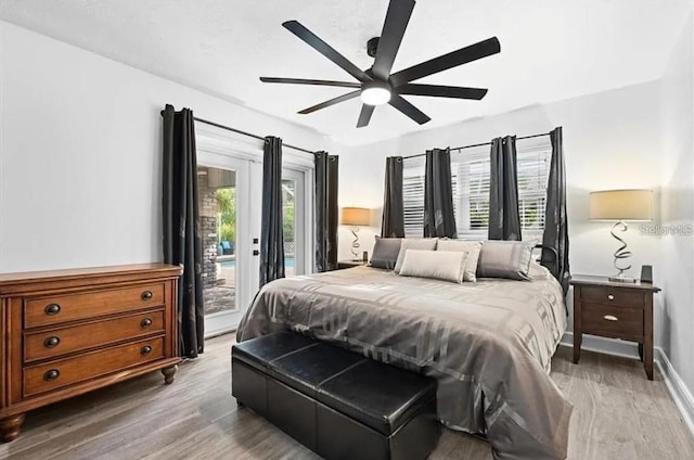 bedroom with access to exterior, ceiling fan, and wood-type flooring