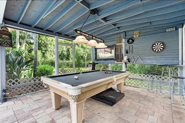 recreation room featuring wood walls, pool table, and vaulted ceiling