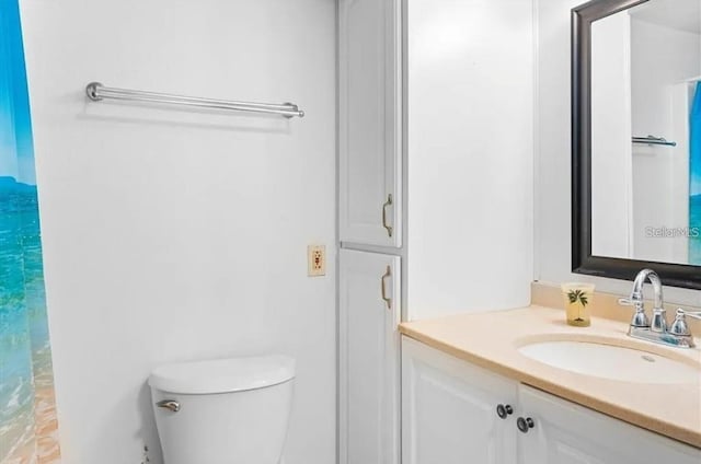 bathroom with vanity and toilet