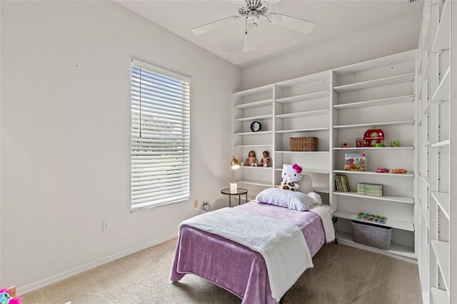 bedroom featuring ceiling fan and carpet