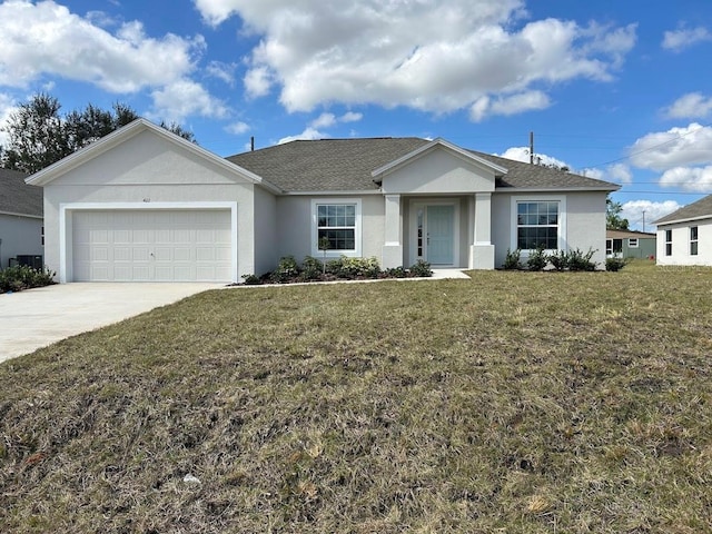 single story home featuring a garage, driveway, a front yard, and stucco siding