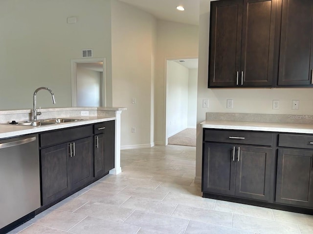 kitchen with dark brown cabinetry, a sink, visible vents, light countertops, and dishwasher