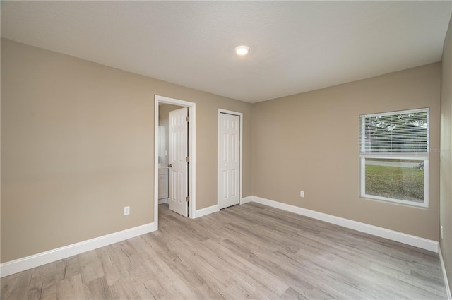 unfurnished bedroom featuring light hardwood / wood-style flooring