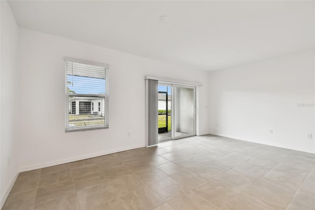 empty room with light tile patterned floors