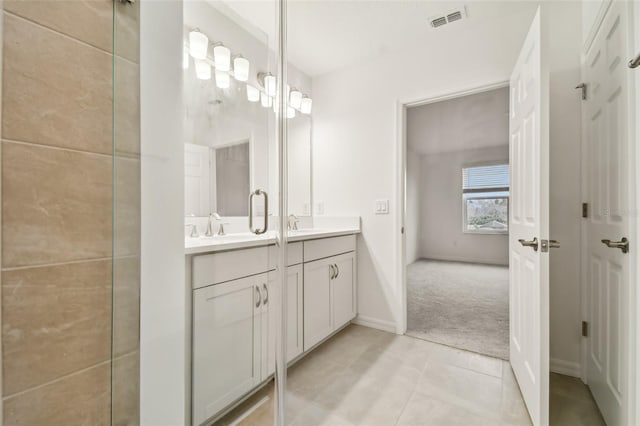 bathroom featuring tile patterned floors and vanity