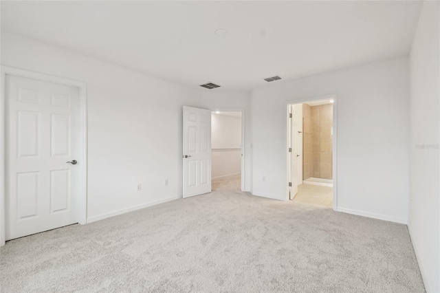 empty room featuring light colored carpet