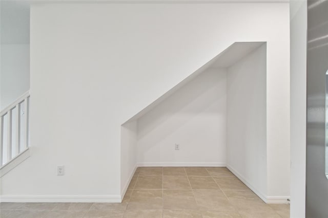 bonus room featuring light tile patterned floors