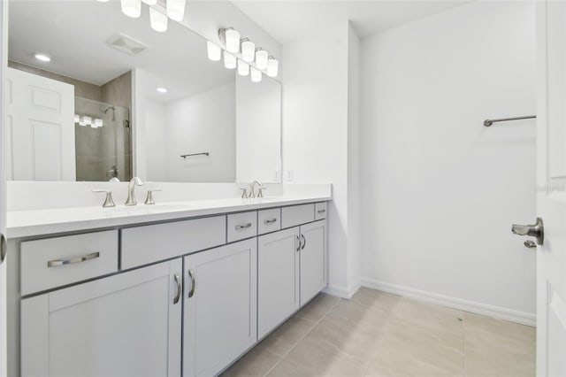 bathroom featuring vanity, tile patterned flooring, and a shower with door